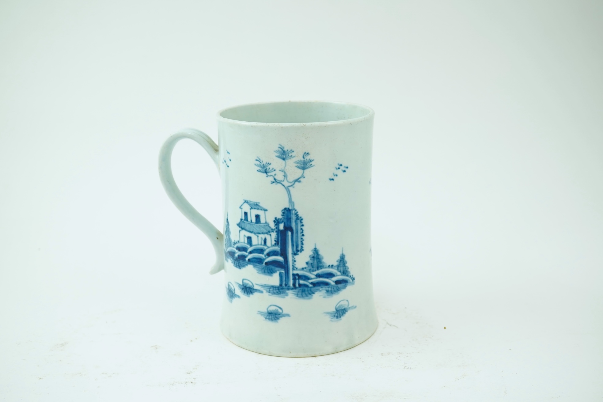 A large Worcester blue and white scratch cross type mug or tankard decorated in the Plantation pattern, c.1754-56